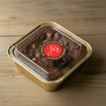 Brownie barquette dorée fermée avec logo - vue overhead
